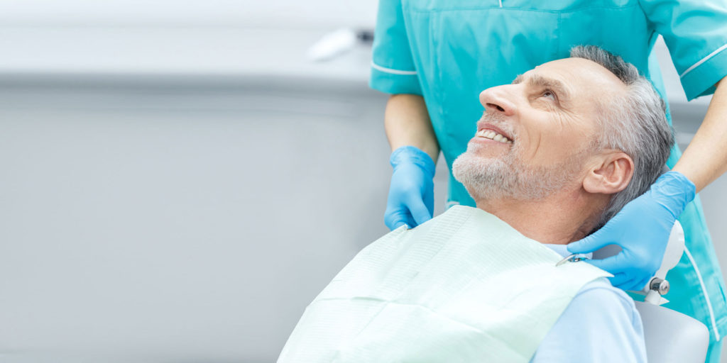 dental patient in dental chair after procedure